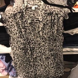 animal print sleeveless blouse. Ruffle details